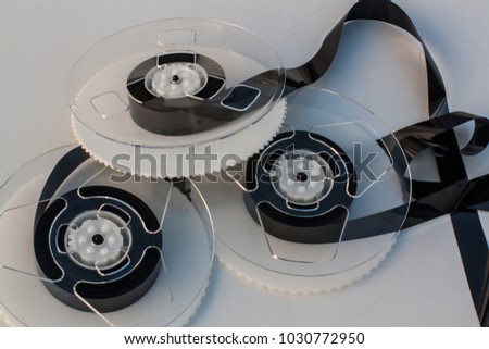 Few VHS video coils disassembled from casettes  on white background