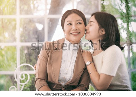 Daughter hug and kissing her mother, Happy family concept.