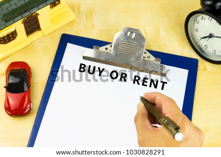 a clipboard with text buy or rent. financial property concept. 