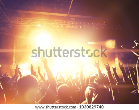 Concert hall with people clapping