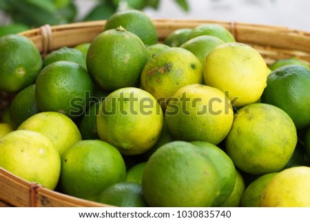 Ripe and unripe lemons in a weaving basket