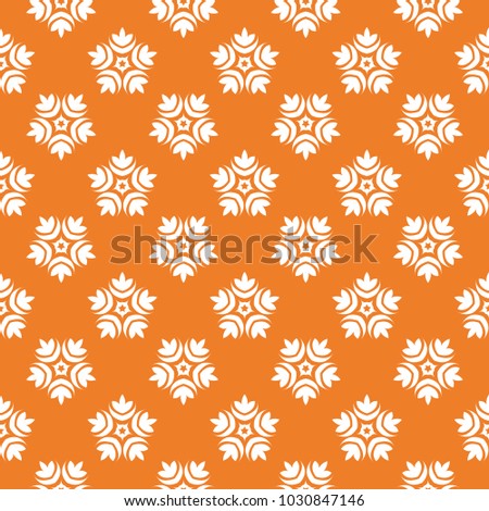 White floral ornament on orange background. Seamless pattern for textile and wallpapers