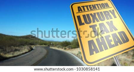 Luxury tax ahead road sign on a sky background and dessert road