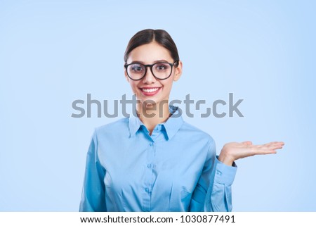 Portrait of young beautiful business woman in glasses.