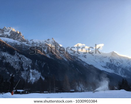 View of snow-covered mountains during a sunnyday. Blue and white colourful picture.