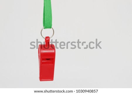 Red whistle with green line