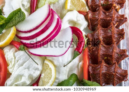 Cig kofte, a raw meat dish in Turkish and Armenian cuisines. Turkish cig means "raw" and kofte means meatball.