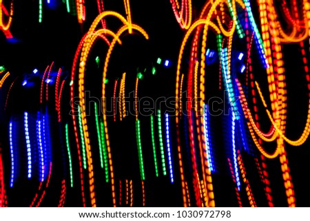 The beautiful lighting of path when there is movement of the origin of multi colored lights. Slow shooting style and light color blur Applied as a backdrop