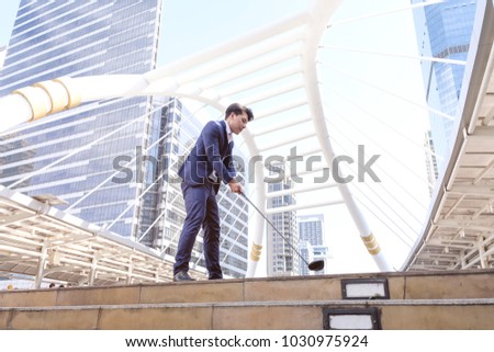 Young asian businessman playing golf in outdoor city, business sportsman who perfect body exercise by golf, business man success in job, business people healthy lifestyle concept