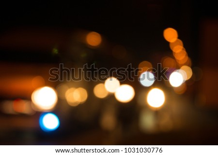 Abstract Blur Defocus Bokeh Background of Car Light Glowing or Illuminate at night as Citylife or Modern City lifestyle Concept.