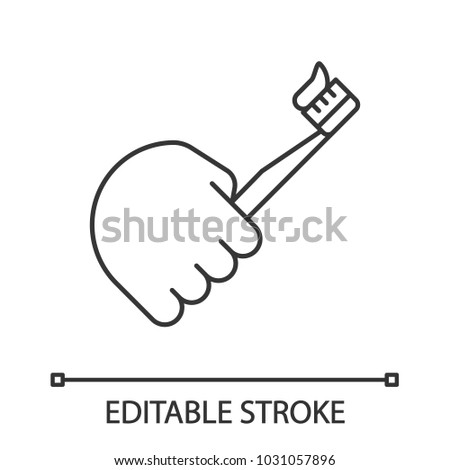 Hand holding toothbrush linear icon. Thin line illustration. Teeth cleaning. Contour symbol. Vector isolated outline drawing. Editable stroke