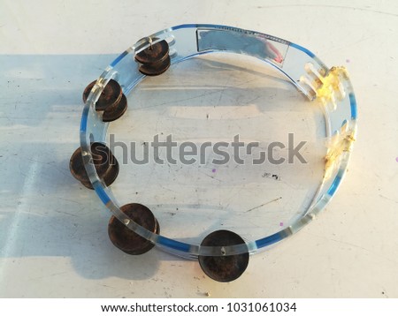 
Damaged Tambourine Put on a white table