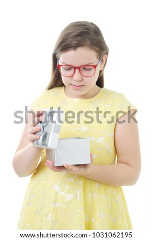 An image of young girl with gift box