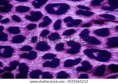 ultra violet leopard patterned fabric texture.