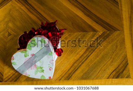 High resolution heart shaped box on a wooden table.