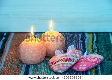 round candles are lit, two round candles, the fire burns the wick