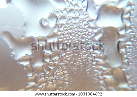 Texture drops on bottle close-up blurred background macro photography