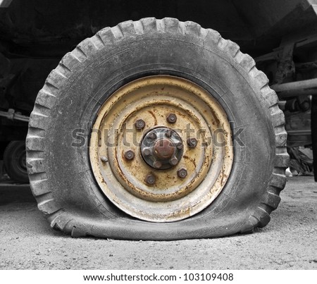 Flat tire Royalty-Free Stock Photo #103109408