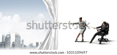 Two businesspeople pulling white blank fabric with rope