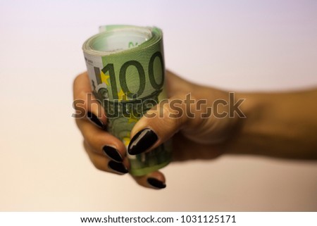 Female hands holding, counting and handling 100 Euro money bills