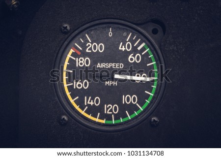 Vintage airspeed gauge on a biplane while in flight Royalty-Free Stock Photo #1031134708