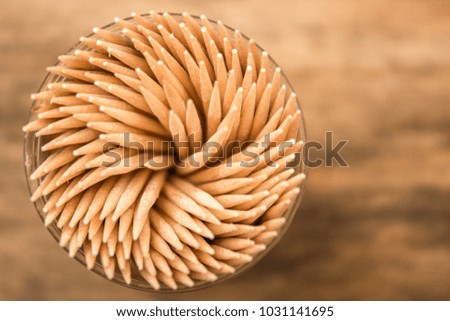 many toothpicks on the brown table background