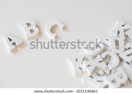 flat lay wooden letters, close up, white background