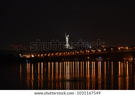 Ukraine, night Kyiv on the banks of the Dnieper, motherland mother