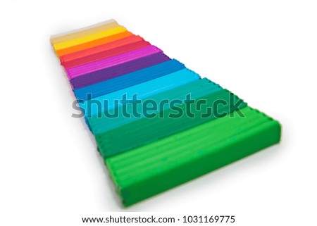 colored plasticine on isolated white background