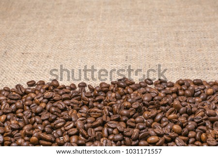 coffee beans on burlap background

