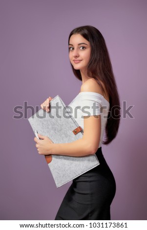 Girl brunette asian. Girl brunette asian holding folder isolated purple background. Portrait beautiful young woman looking at camera smiling. Elegant swarthy pretty female. Concept education