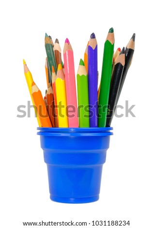 Color drawing pencils in the blue plastic cup, isolated