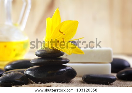 stones for spa and yellow flower