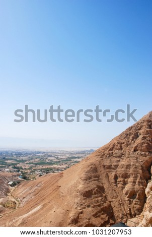 Vertical picture from the top of Mount Temptation in Jericho during blue sky day, Israel