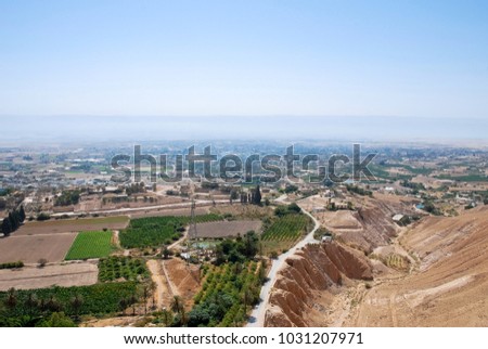 Horizontal picture of local farms irrigated by Jordan River in the desert located in the city of Jericho, Israel