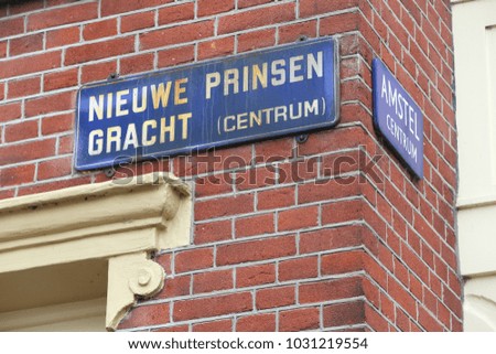 Amsterdam, Netherlands - street name sign. Nieuwe Prinsen Gracht canal.
