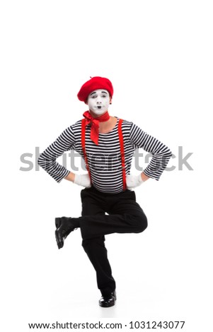 funny mime performing on one leg isolated on white