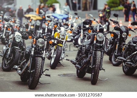 salon selling motorcycles, motorcycles stand in a row on the site. Royalty-Free Stock Photo #1031270587