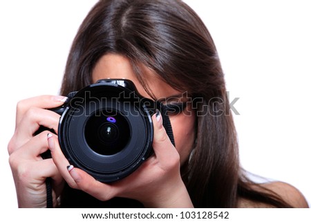 Young female photographer taking pictures