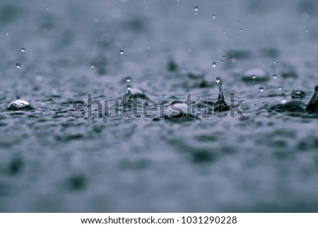  close up rain water drop falling to the floor