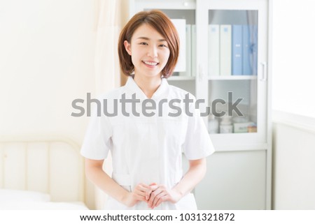 attractive asian nurse of the smile