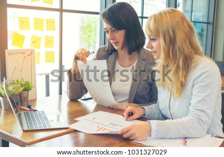 Businesswoman management working on financial dashboard with diversity data on paperwork in hands and sticky note paper. Work collaboration, discussion and talking about forecast, revenue in office. 
 Royalty-Free Stock Photo #1031327029