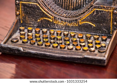 Antique souvenir: "Underwood" Vintage typewriter on wooden surface