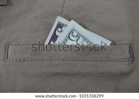money in pants pockets, 5 dollars in jeans pockets