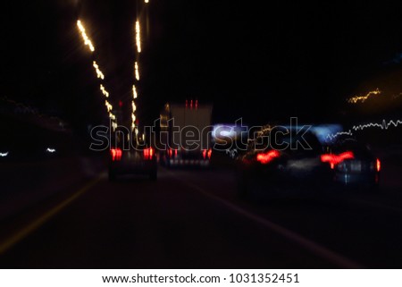 Speed motion, abstract background. Colorful vibrant light trace from night traffic. Abstract image of night traffic in the city. Blurred car lights, long exposure photo of traffic. 