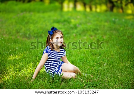 Little girl on the grass