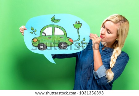 Electric Car with young woman holding a speech bubble