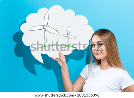 Windmills with young woman holding a speech bubble