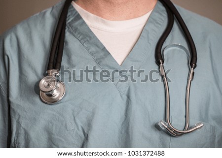 Doctor, surgeon, or nurse in scrubs with a stethoscope