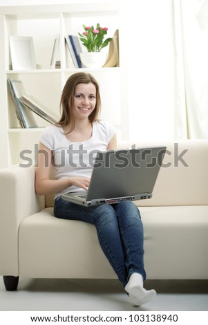 beauty girl with laptop in room